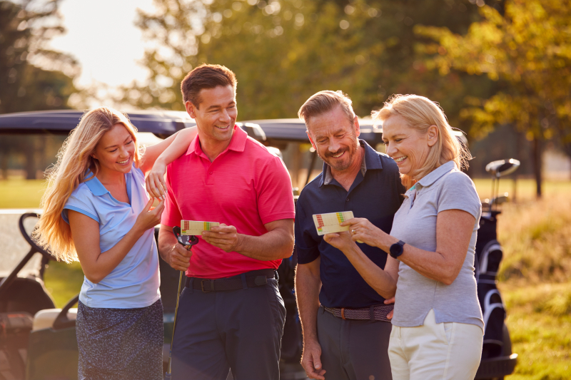 Couples Checking Scorecards